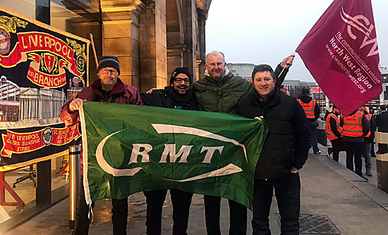 Pic: Carfl Webb with CWU members in support at Lime Street Station